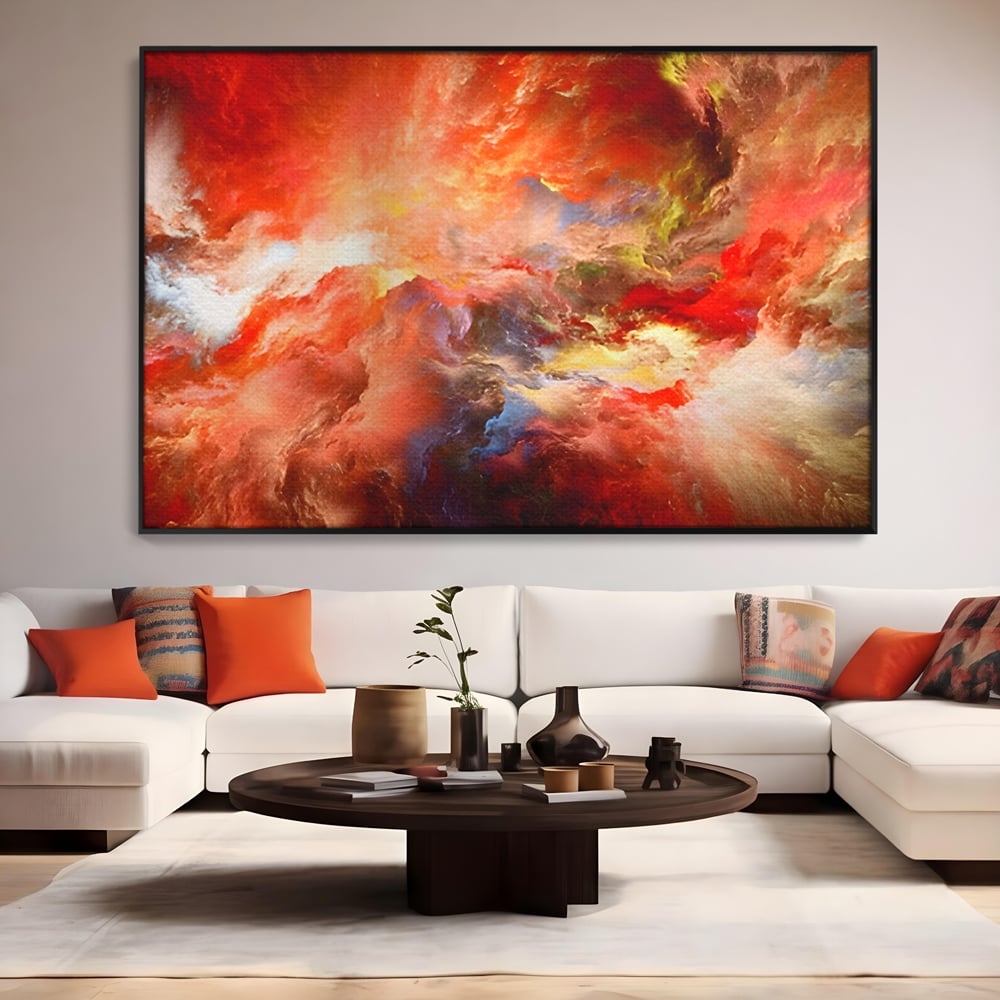 Tablou canvas cu pictura abstracta cu nori rosii, in rama de aluminiu negru, pe perete intr-un living